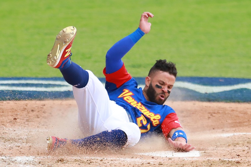 ZAPOPAN, MEXICO - MARCH 11: Jose Altuve #27 of Venezuela slides into home base to score in the top of the fifth inning during the World Baseball Classic Pool D Game 3 between Venezuela and Italy at Panamericano Stadium on March 11, 2017 in Zapopan, Mexico. Miguel Tovar/Getty Images/AFP