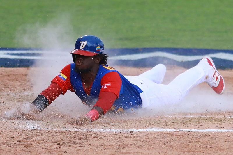 ZAPOPAN, MEXICO - MARCH 11: Odubel Herrera #37 of Venezuela slides into home base to score in the top of the sixth inning during the World Baseball Classic Pool D Game 3 between Venezuela and Italy at Panamericano Stadium on March 11, 2017 in Zapopan, Mexico. Miguel Tovar/Getty Images/AFP
