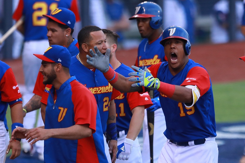 ZAPOPAN, MEXICO - MARCH 11: Salvador Perez #15 of Venezuela celebrates after scoring in the top of the ninth inning during the World Baseball Classic Pool D Game 3 between Venezuela and Italy at Panamericano Stadium on March 11, 2017 in Zapopan, Mexico. Miguel Tovar/Getty Images/AFP