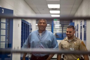O.J. Simpson(L) walks during his parole hearing at the Lovelock Correctional Center in Lovelock, Nevada on July 20, 2017. Disgraced former American football star O.J. Simpson was granted his release from prison on Thursday after serving nearly nine years behind bars for armed robbery.A four-member parole board in the western US state of Nevada voted unanimously to free the 70-year-old Simpson after a public hearing broadcast live by US television networks. / AFP PHOTO / POOL / Sholeh L MOLL-MASUMI / RESTRICTED TO EDITORIAL USE - MANDATORY CREDIT "AFP PHOTO /POOL/NEVADA PAROLE BOARD/SHOLEH L MOLL-MASUMI - NO MARKETING NO ADVERTISING CAMPAIGNS - DISTRIBUTED AS A SERVICE TO CLIENTS
