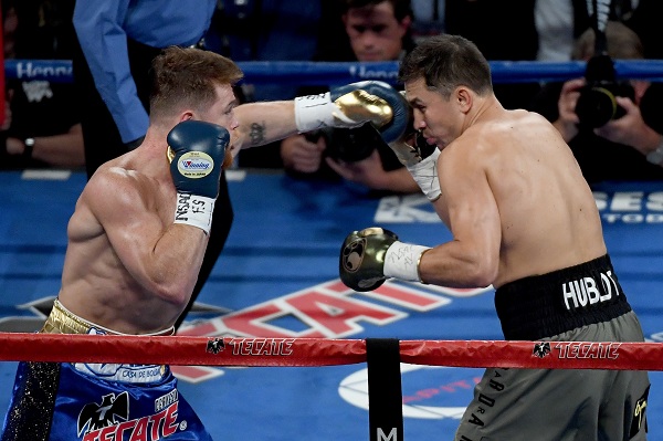 LAS VEGAS, NV - SEPTEMBER 16: (L-R) Canelo Alvarez throws a punch at Gennady Golovkin during their WBC, WBA and IBF middleweight championship bout at T-Mobile Arena on September 16, 2017 in Las Vegas, Nevada.   Ethan Miller/Getty Images/AFP