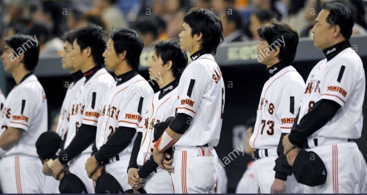 tokyo japan players of the yomiuri giants wear black ribbons on their JNT3WT